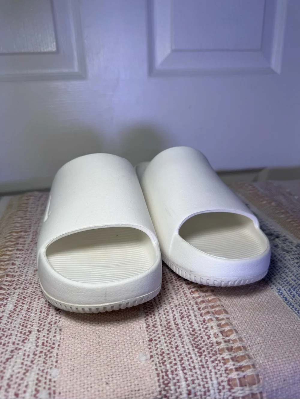 Nike Calm White Slide Sandals.
